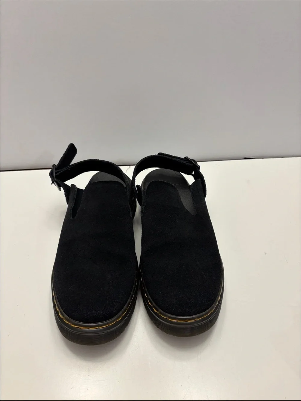 Dr. Martens Carlson slingback mules in black suede, with a chunky buckle